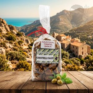 Sachet de canistrelli salés au basilic présentés sur une table en bois avec tomates séchées et basilic
